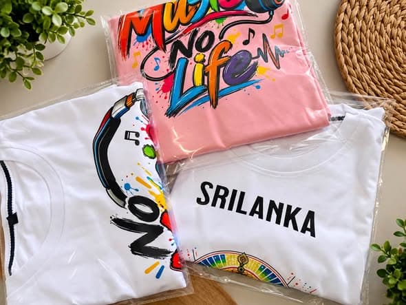 An assortment of Loomer Wear T-shirts with packaging